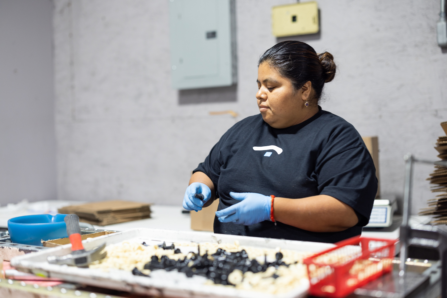 Secondary Solutions team member sorting mixed parts